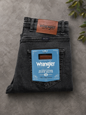 شلوار جین مردانه رانگلر Wrangler زغالی کشی با بافت حولهای و دوخت آزاد